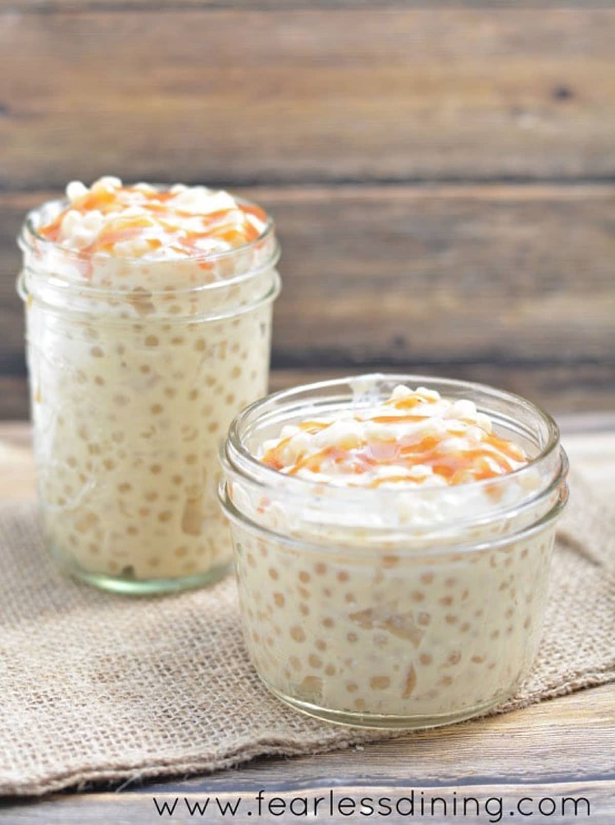 Two jars filled with tapioca pudding.