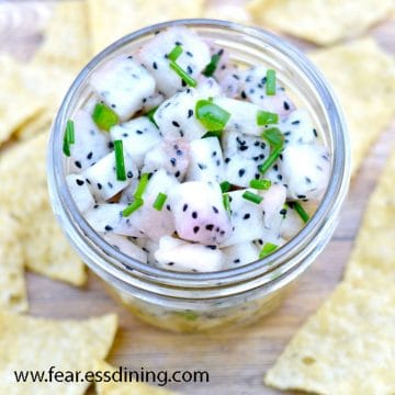 The top view of a jar of dragon fruit salsa.