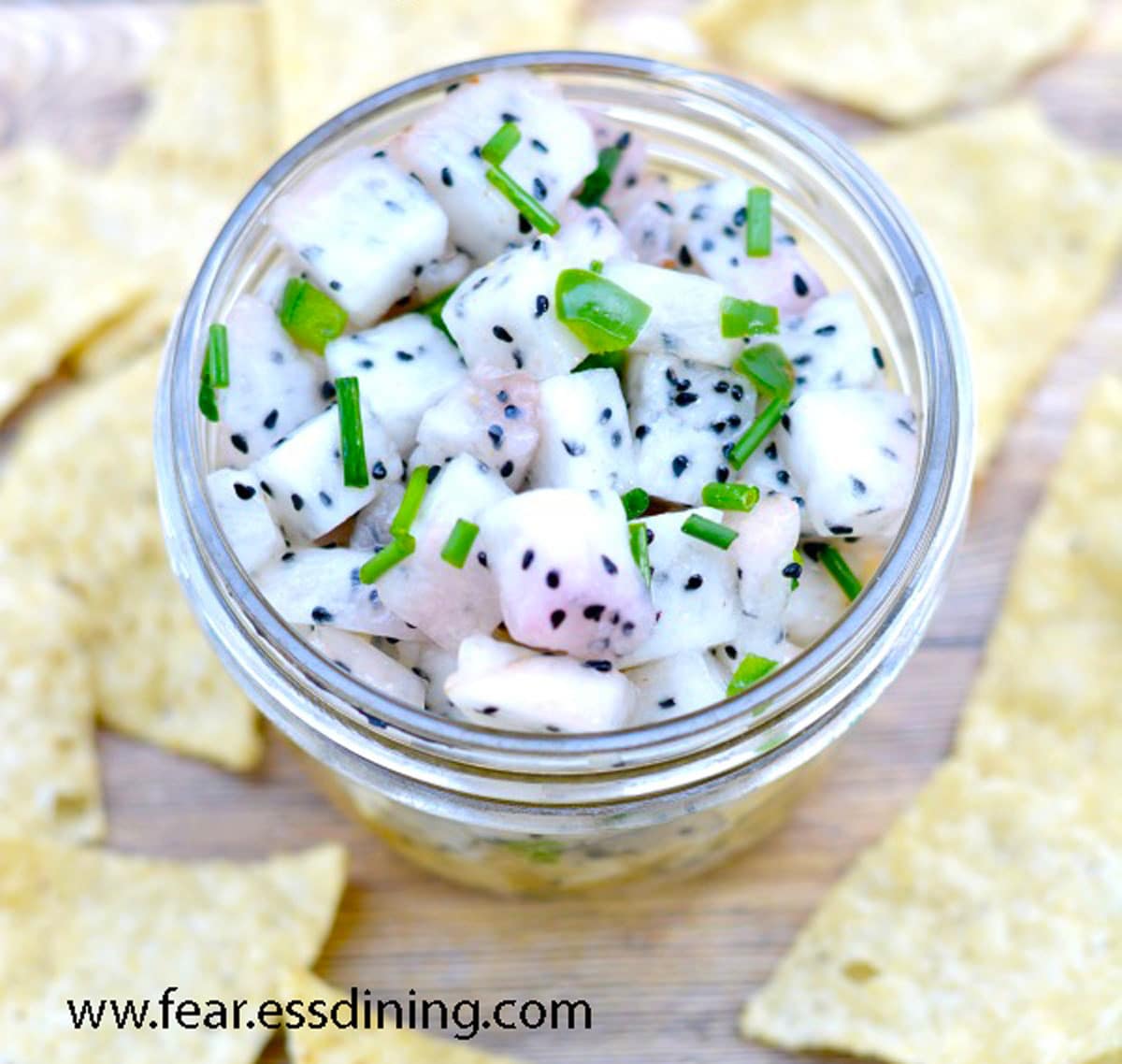 Top view of a jar of dragon fruit salsa.