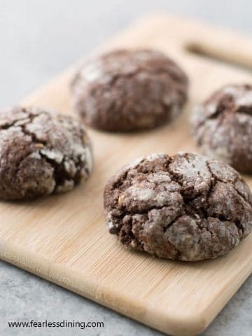 chochocolate crinkle cookies on a cutting board