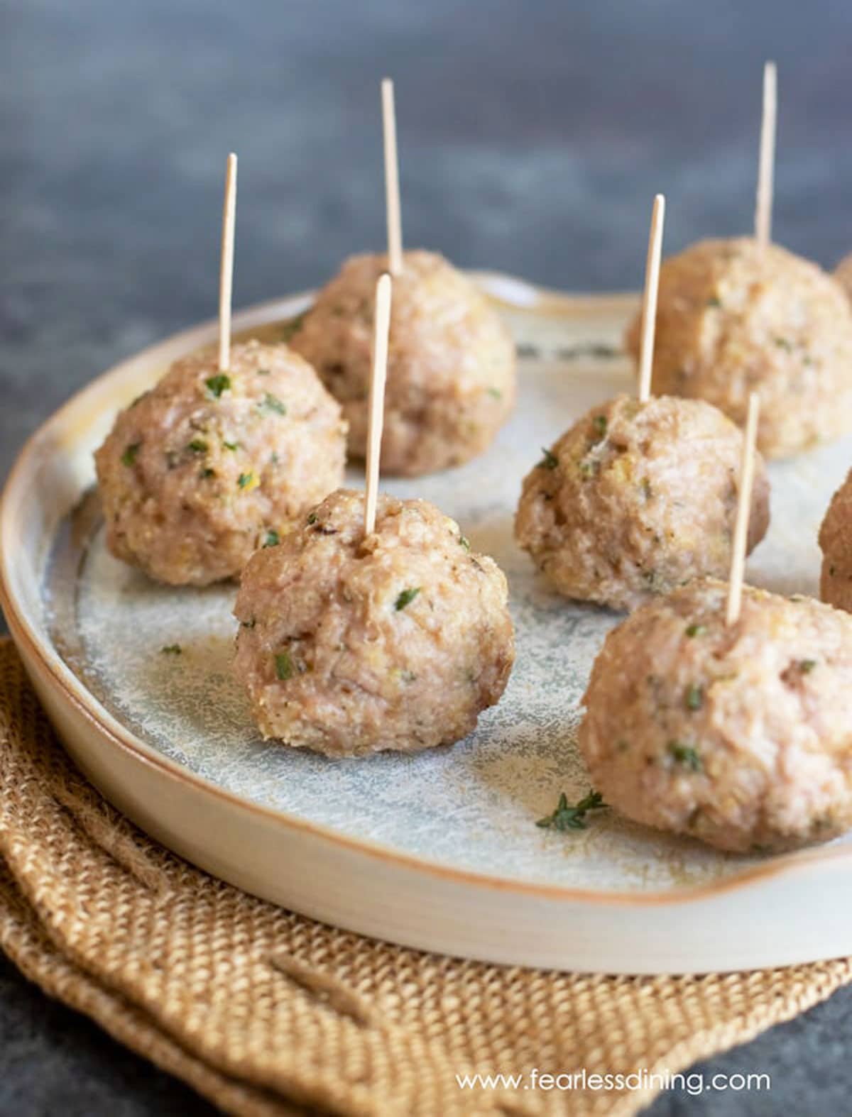 A serving dish full of chicken meatballs.