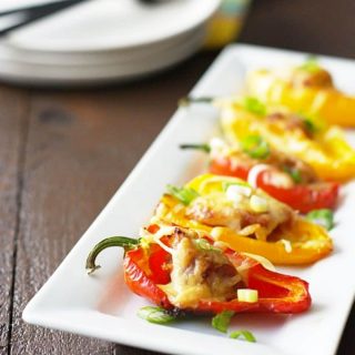 a white rectangular dish filled with stuffed peppers