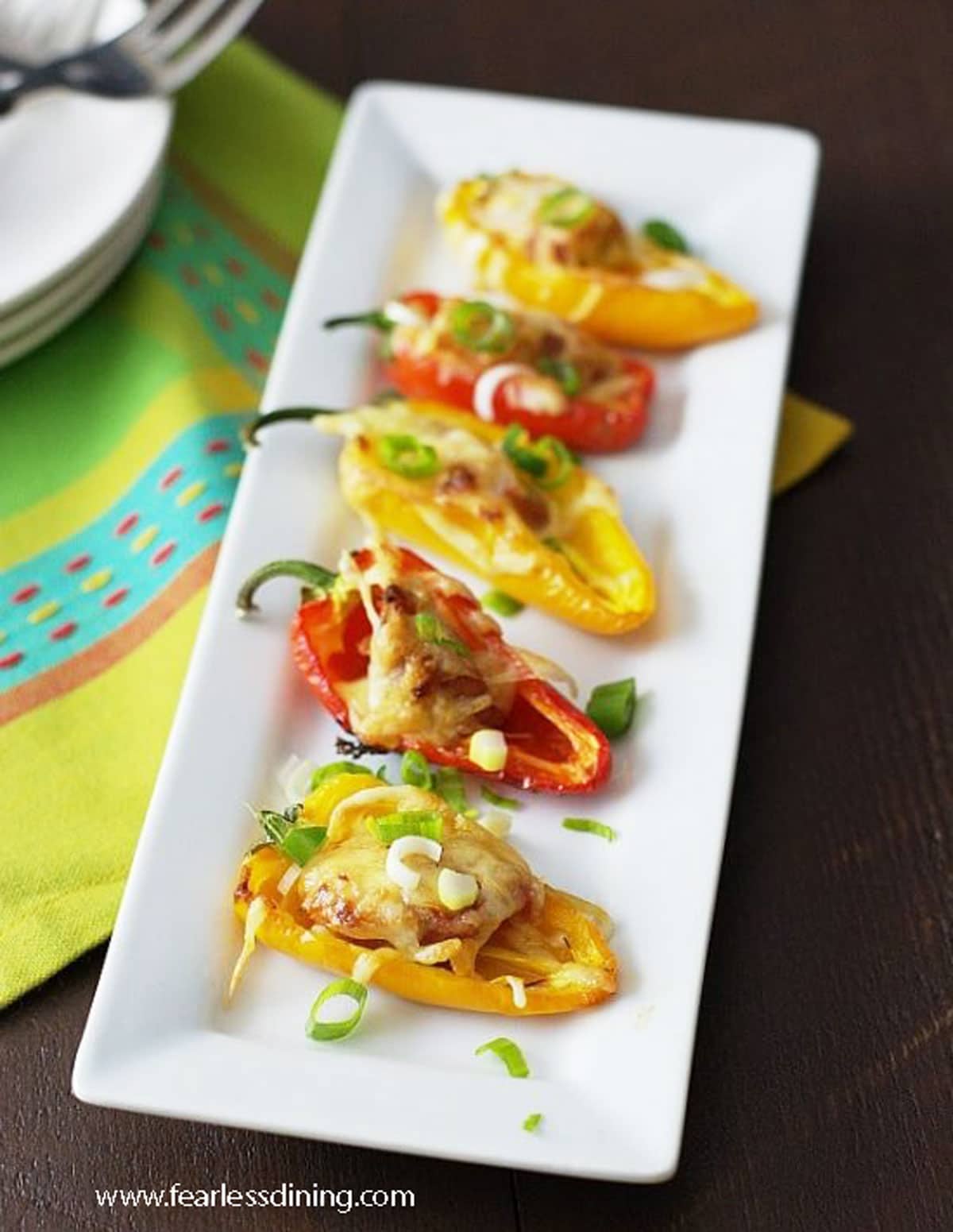The top view of a platter of stuffed peppers on the table.