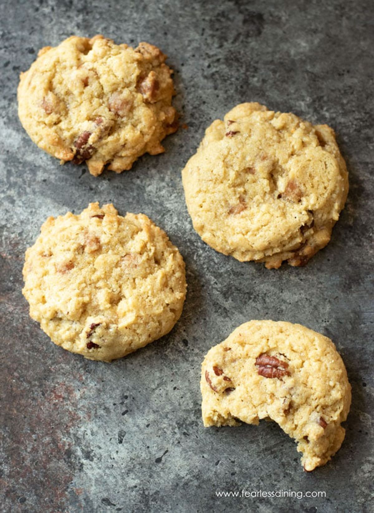 Butter pecan cookies on a cookie sheet.