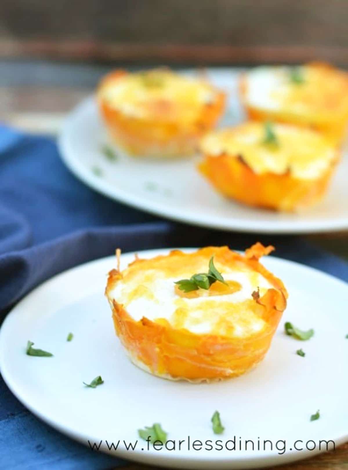 a cooked butternut egg cup on a plate