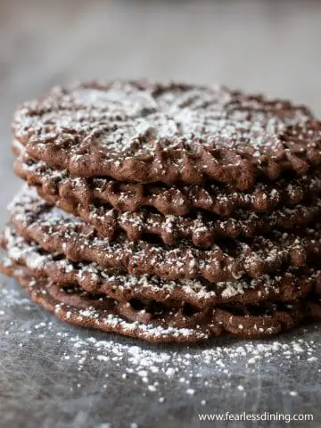 a stack of chocolate pizzelle cookies