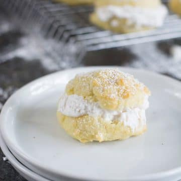 a filled cream puff on a white plate