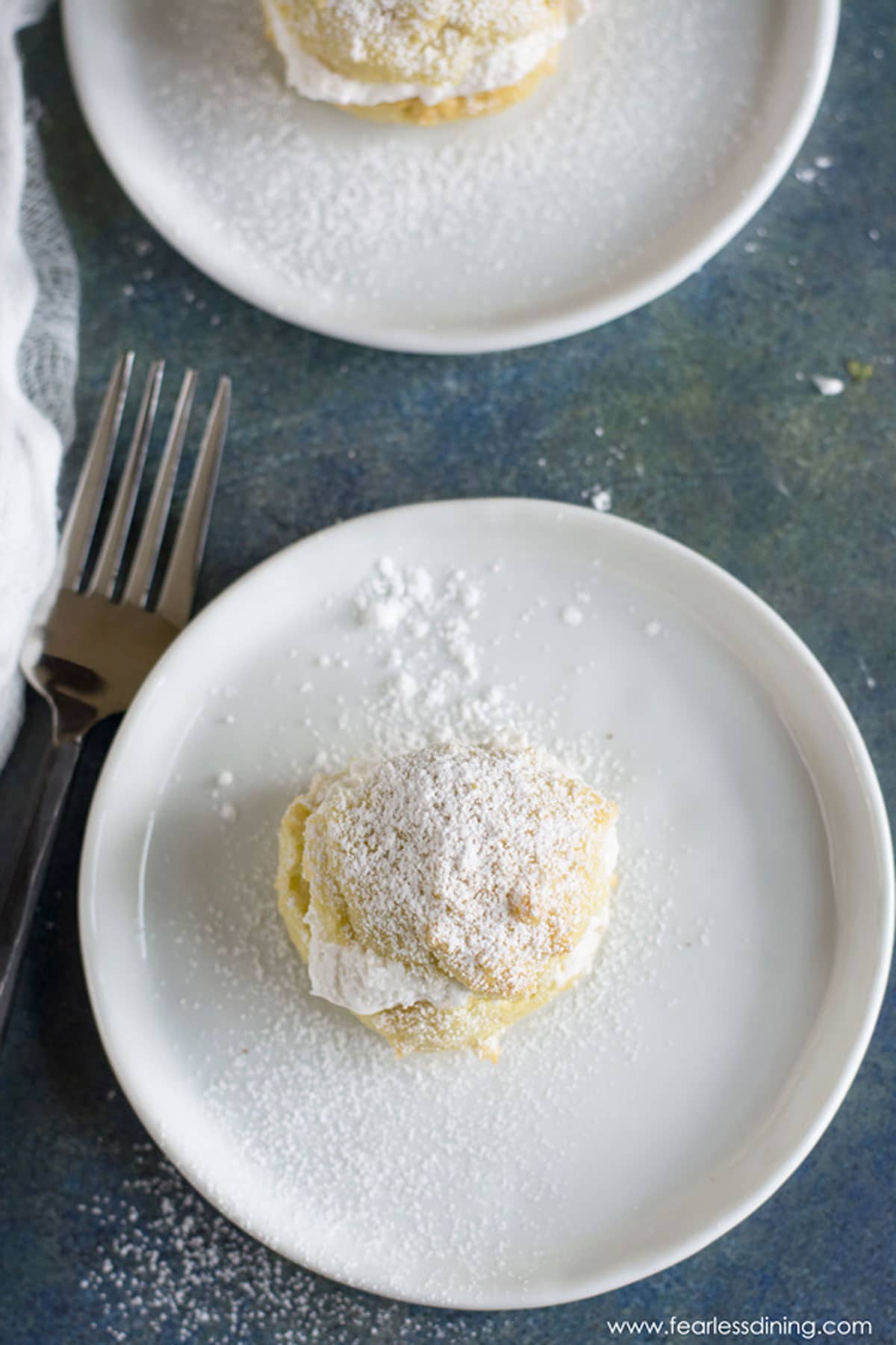 The top view of a cream puff on a plate.