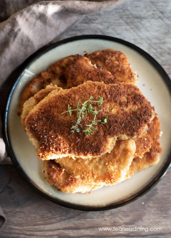 The top view of a plate full of fried schnitzel.