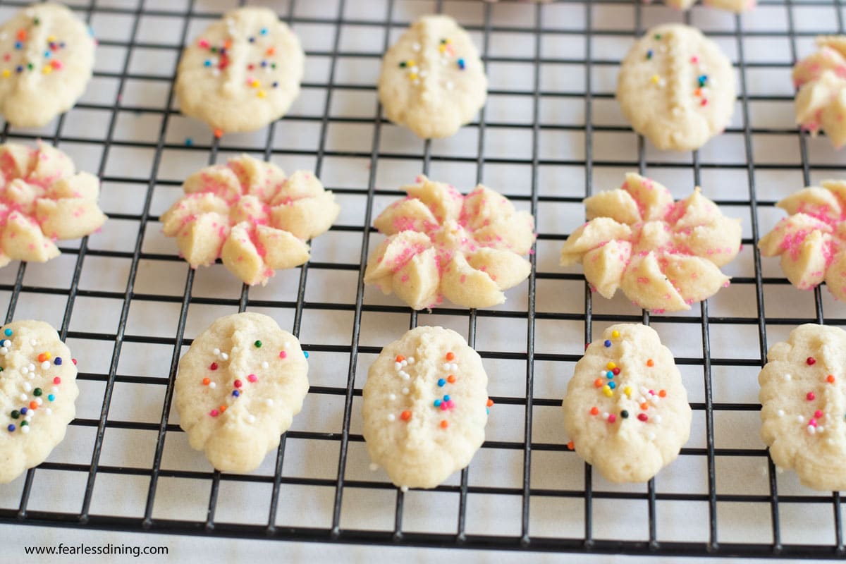 spritz cookies decorated on a rack