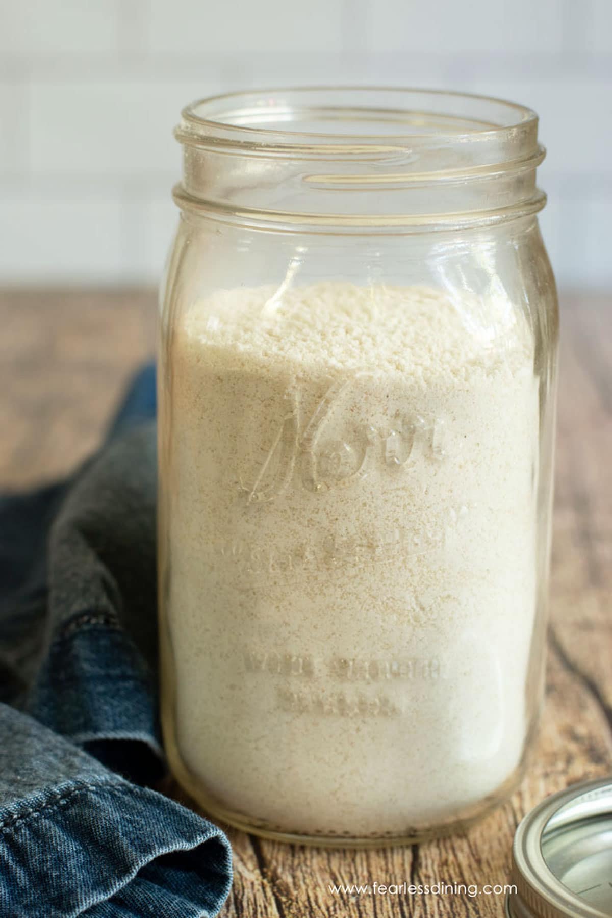 A mason jar filled with gluten-free vanilla cake mix.
