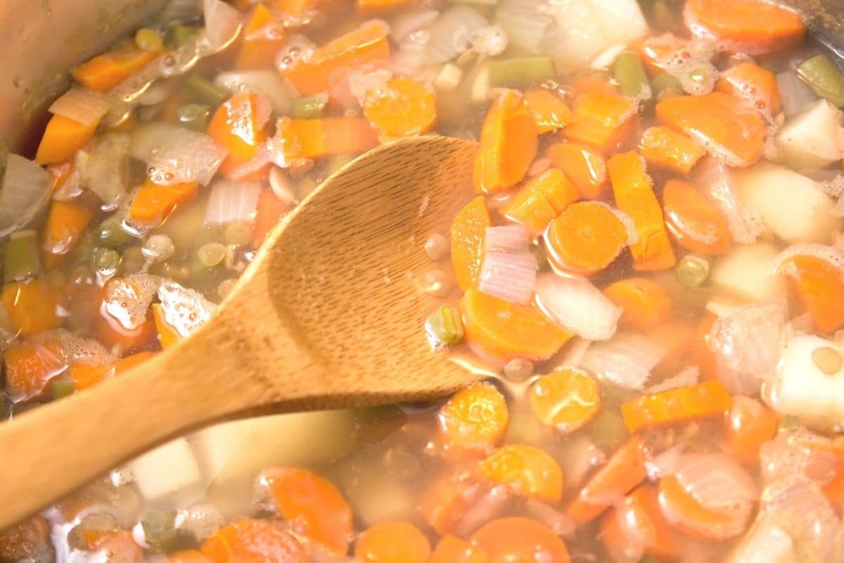 A photo of the lentil soup cooking in a large pot.