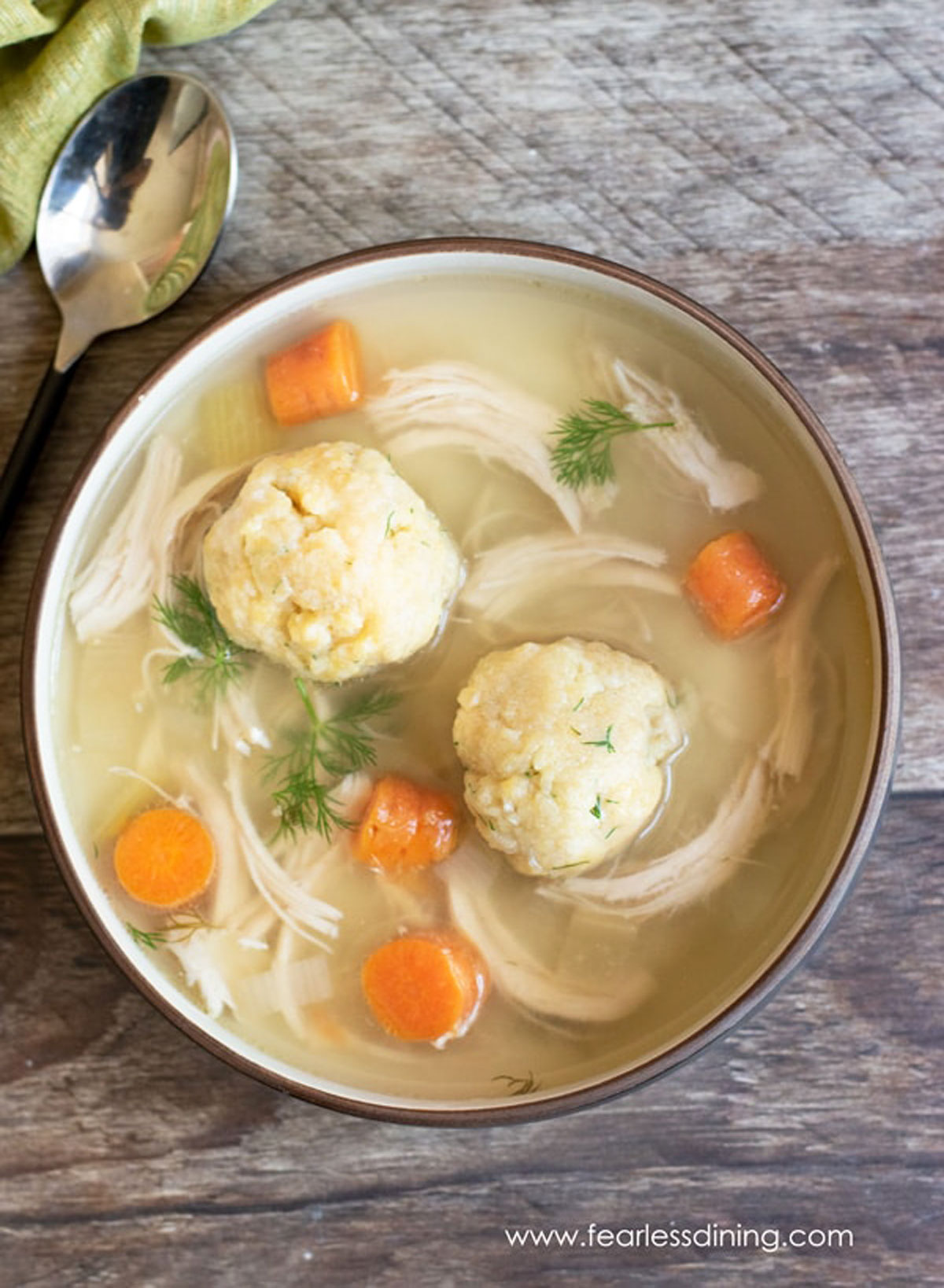 the top view of a big bowl of matzo ball soup