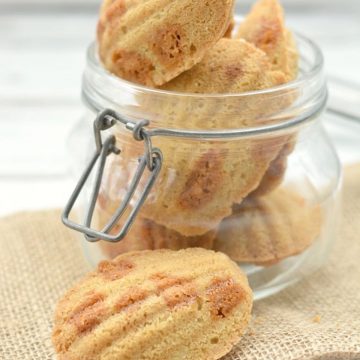 a large glass jar filled with butterscotch madeleines