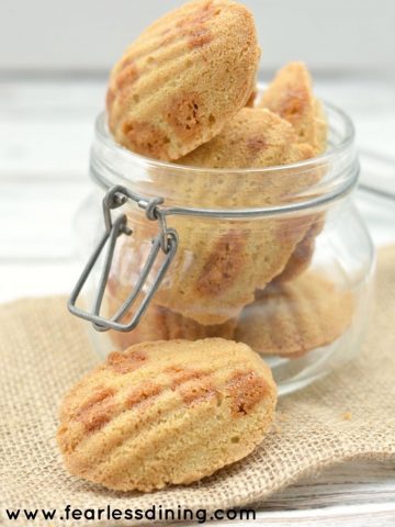 a large glass jar filled with butterscotch madeleines
