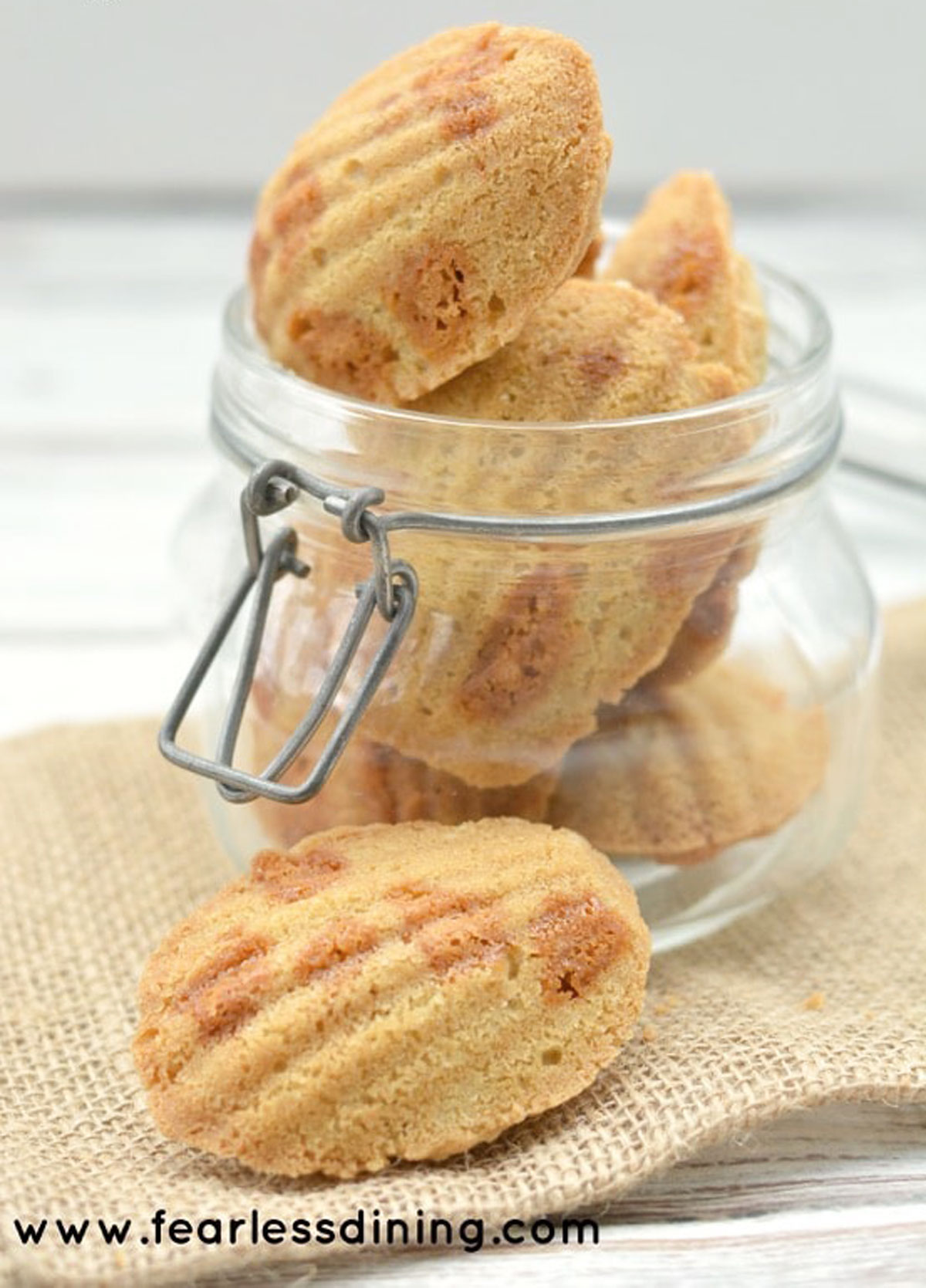 a large glass jar filled with butterscotch madeleines