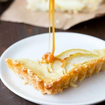 drizzling caramel over a slice of apple tart