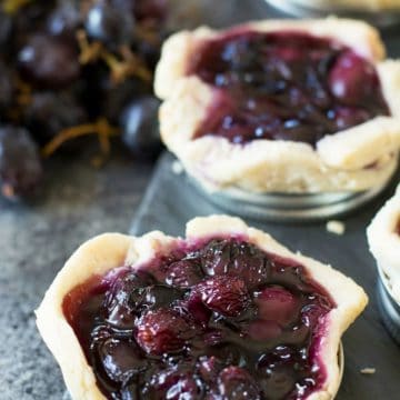 grape galettes on a slate serving dish