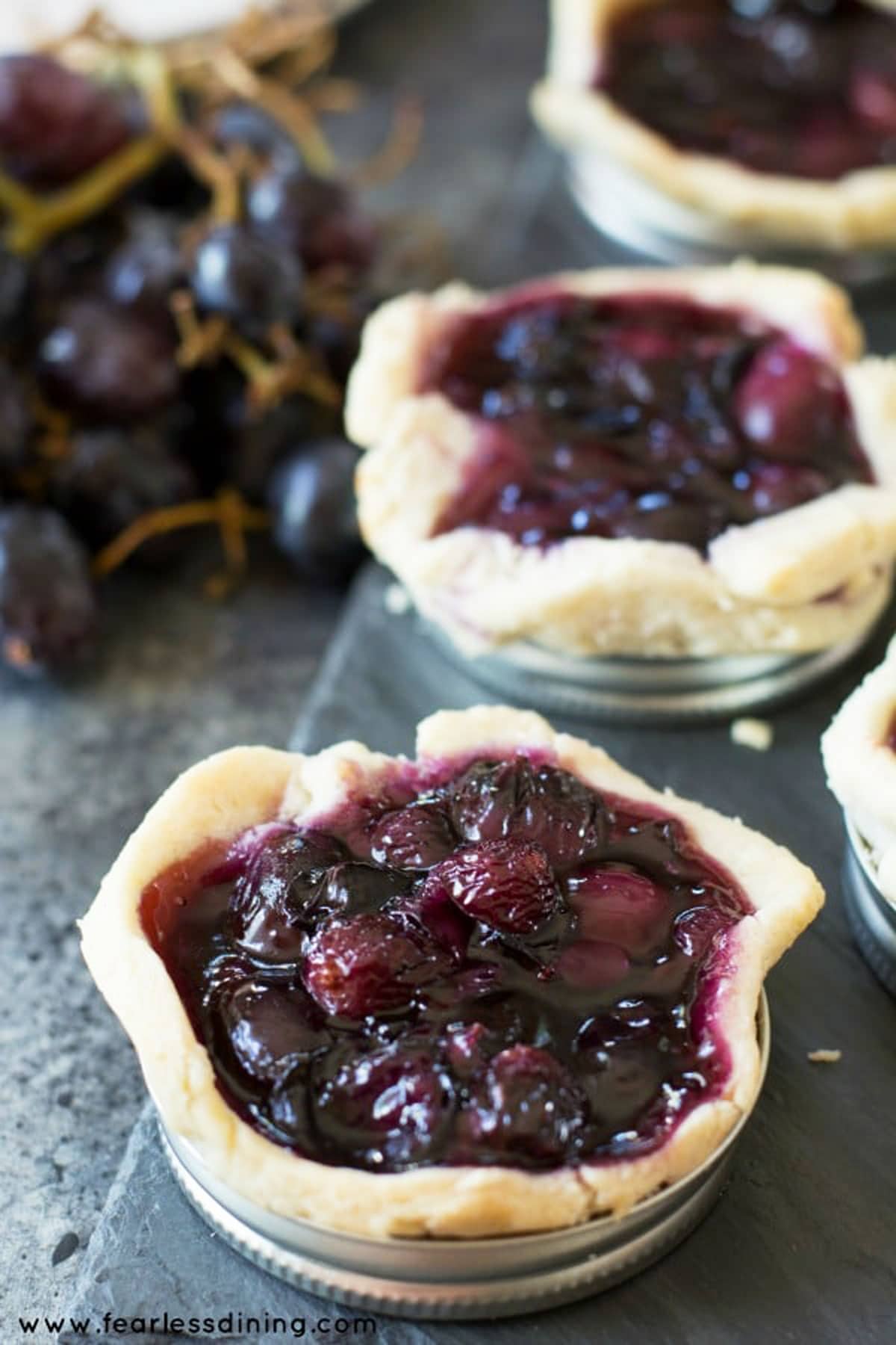 grape galettes on a slate serving dish