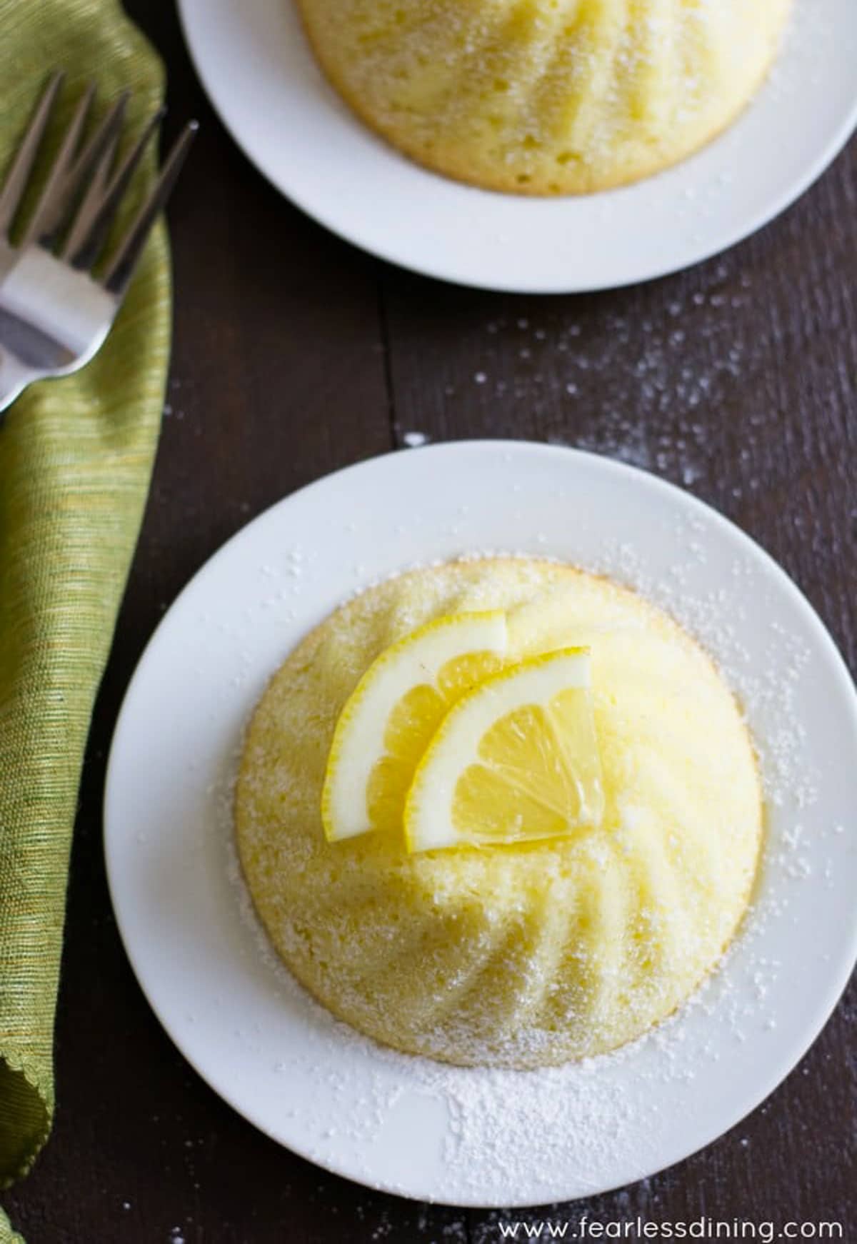 the top view of a lemon yogurt cake with sliced lemons on top