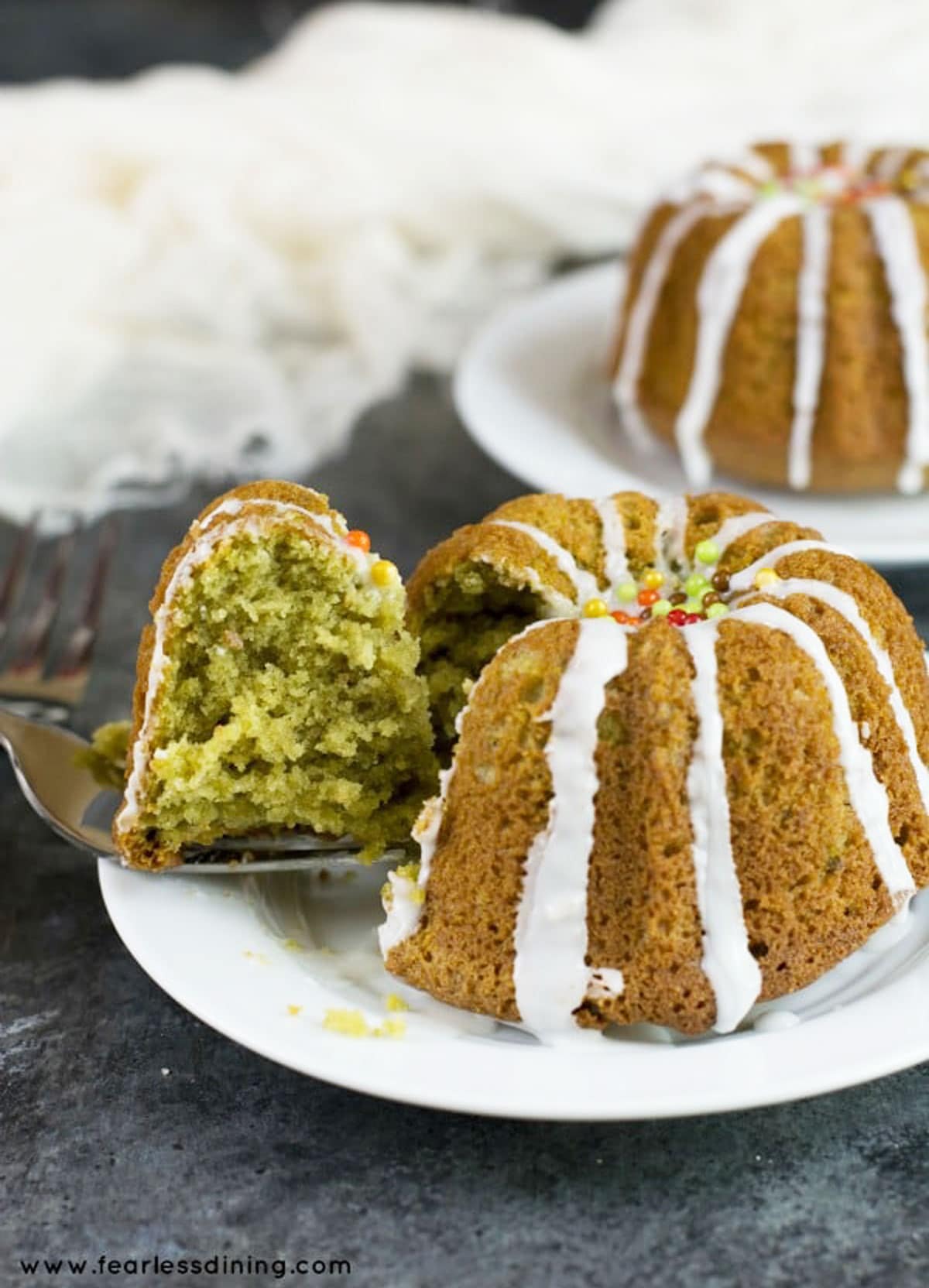 A slice of gluten free matcha bundt cake on a fork.