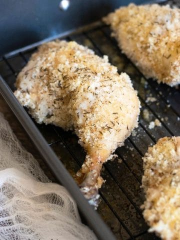 A close up of the oven fried chicken in the baking pan.