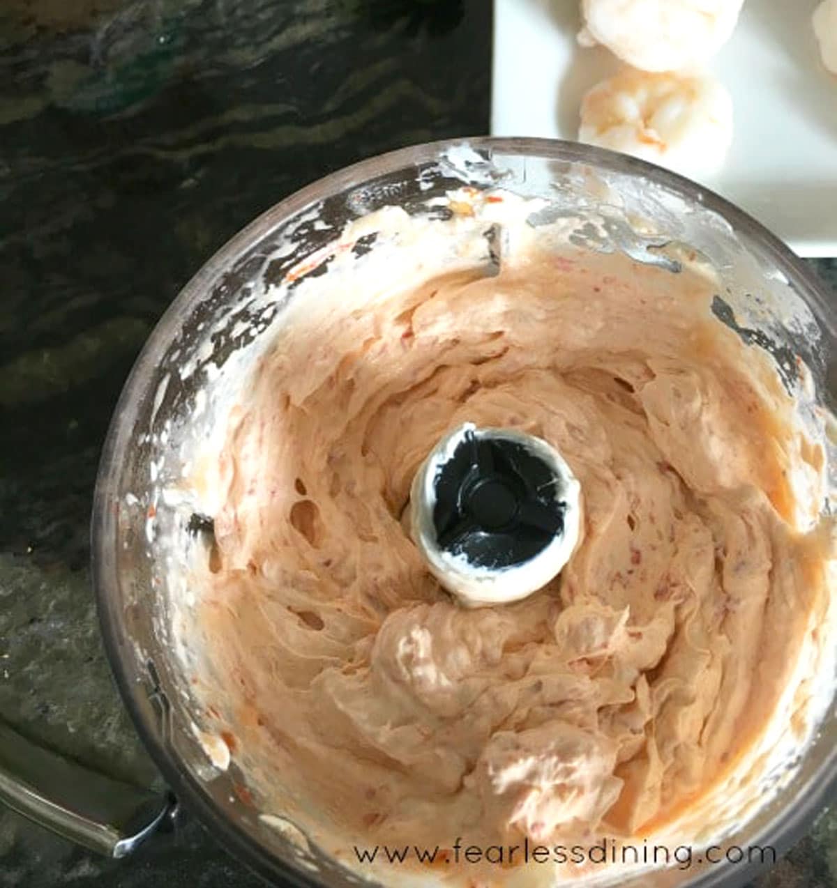 Whipped red pepper cream cheese in the food processor.