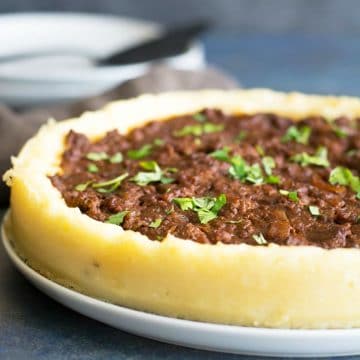 A sloppy joe pie on a serving dish.