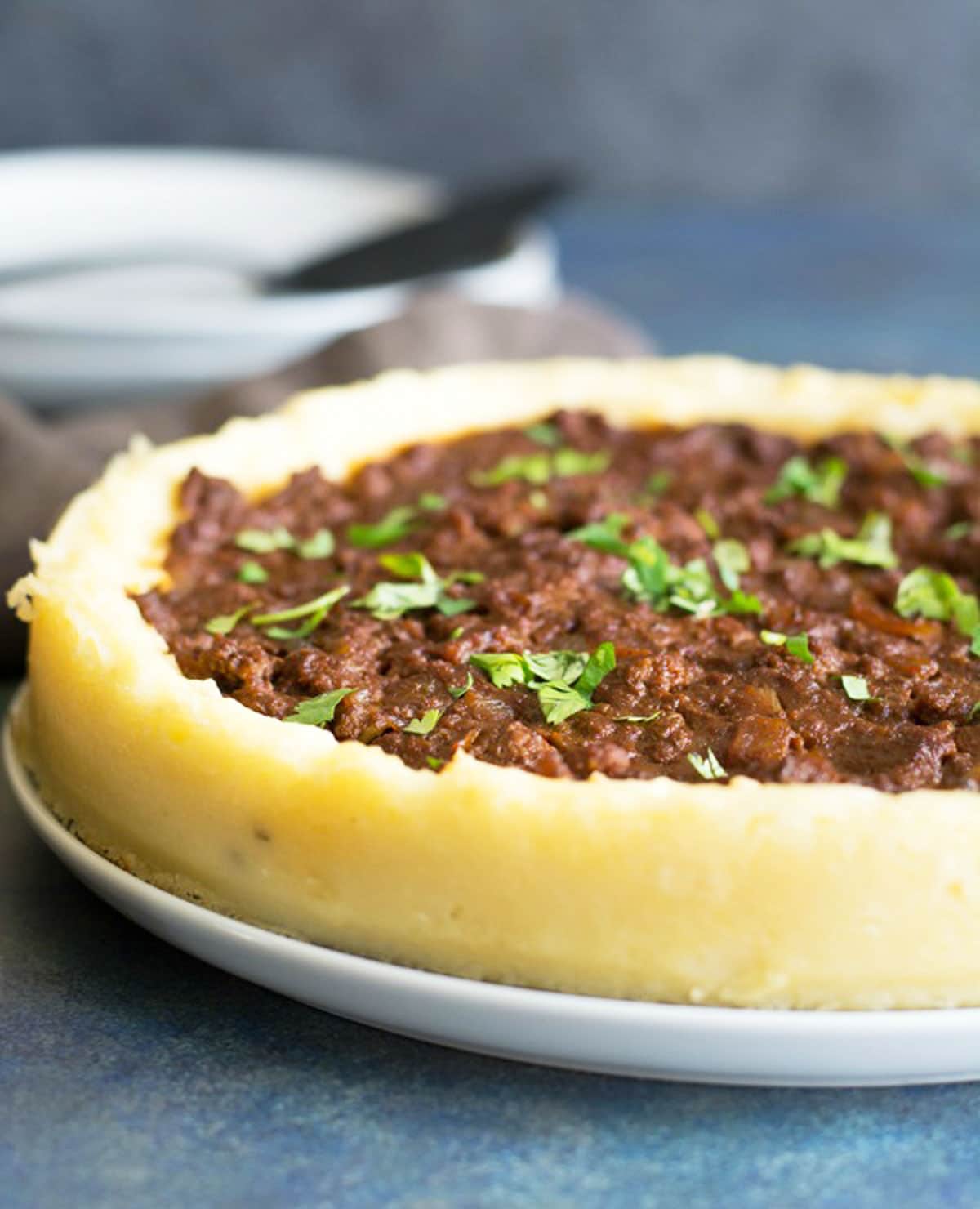 A sloppy joe pie on a serving dish.