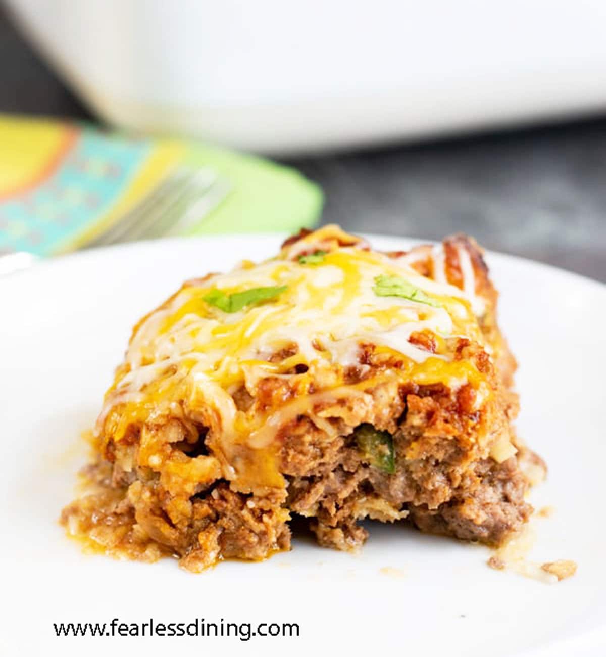 A slice of taco meatloaf on a plate.