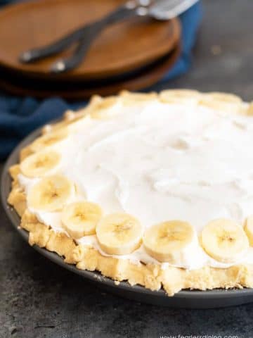 a whole gluten free banana cream pie on a table