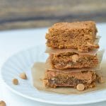 a stack of three blondies on a white plate