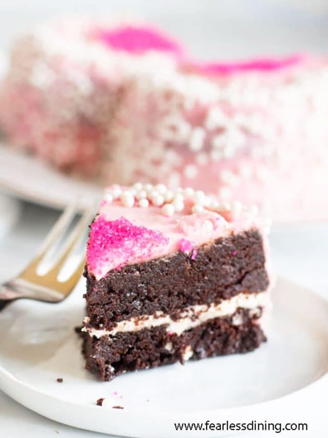 a slice of gluten free brownie layer cake on a plate