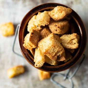 The top view of a full container of croutons.