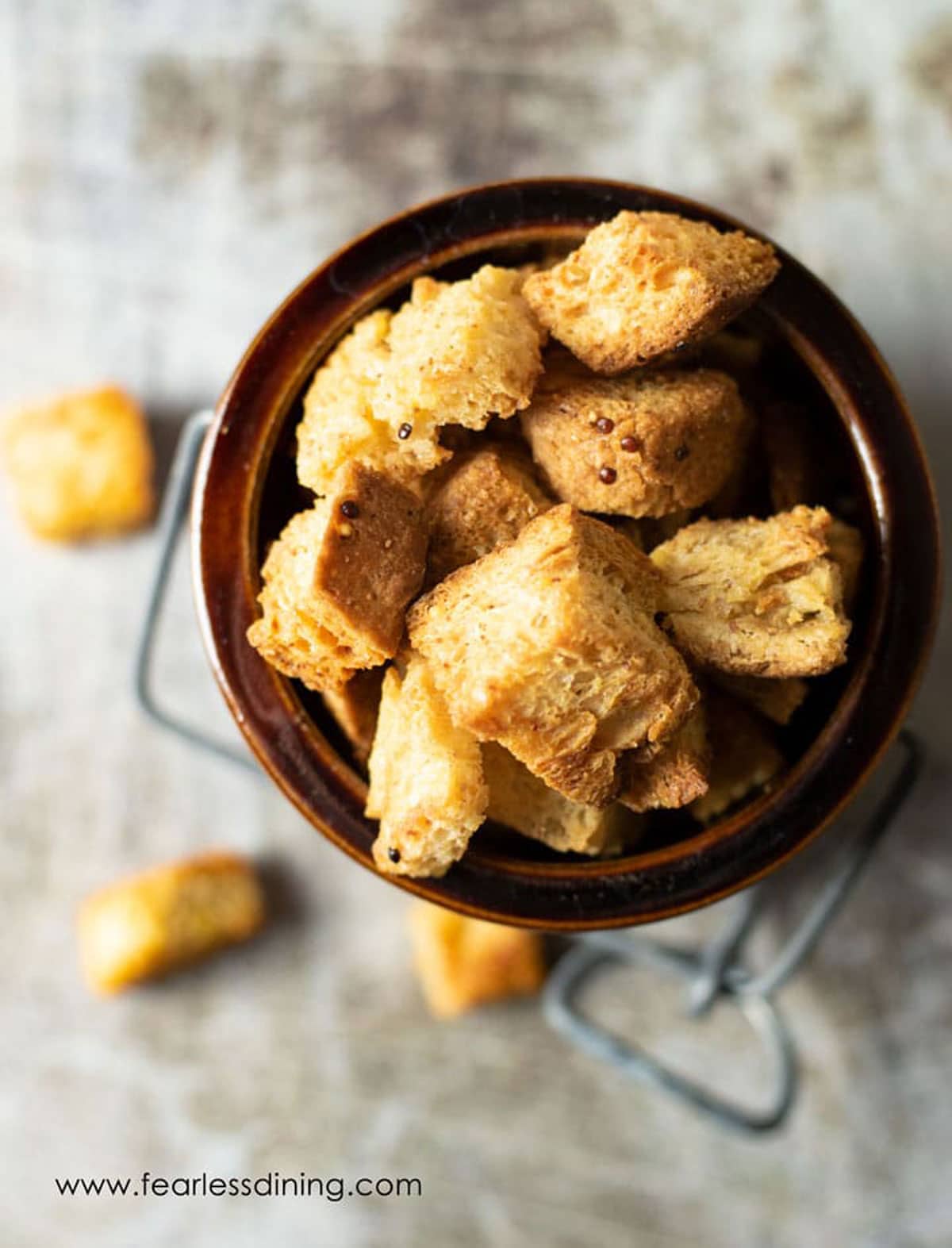 The top view of a full container of croutons.