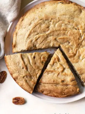 the top of a round gluten cake with two slices cut