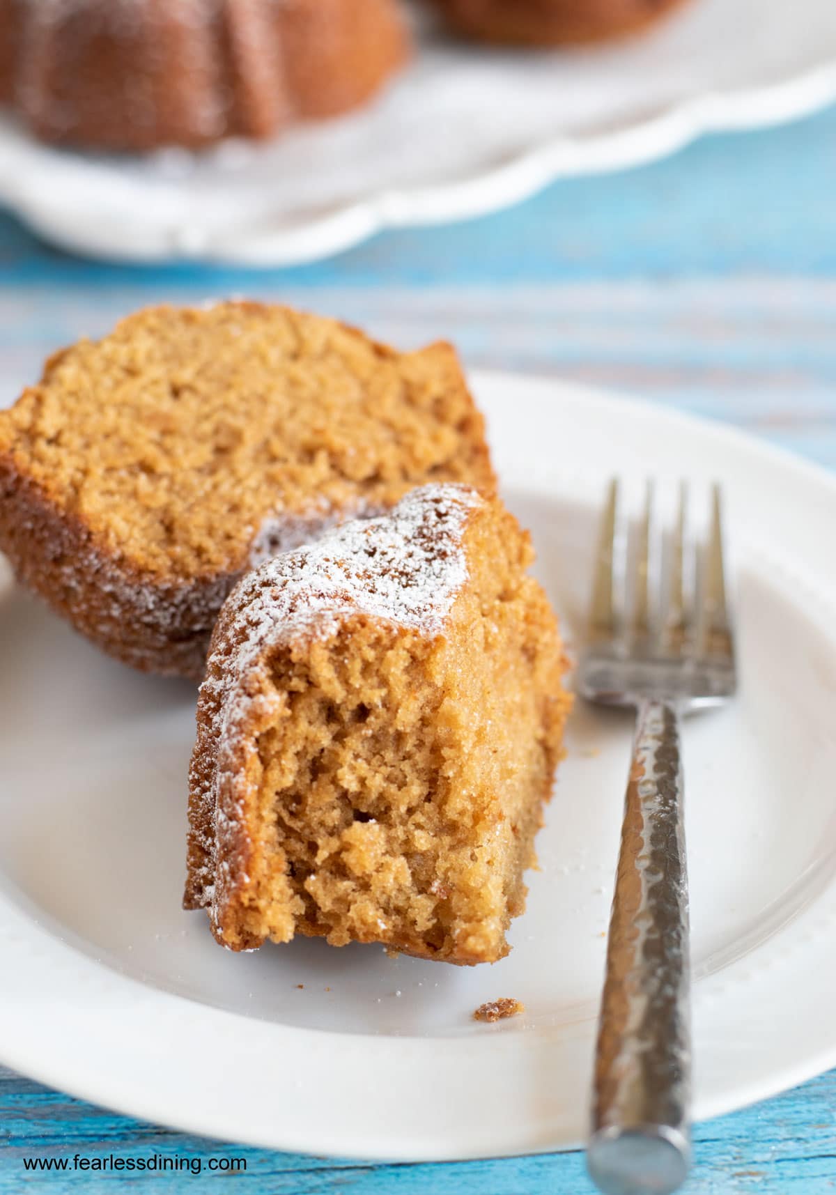 A slice of gluten free honey cake on a plate.