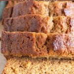 a pinterest pin of a loaf of honey cake sliced on a cutting board