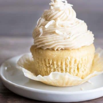 A cupcake with the cupcake wrapper peeled back.