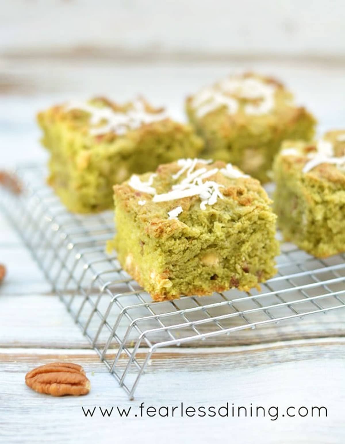 Matcha cookie bars on a cooling rack.