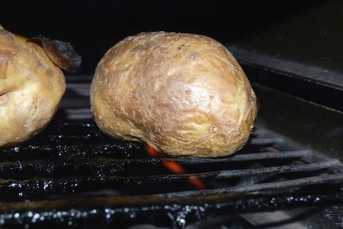 A photo of the baked potatoes in the oven.