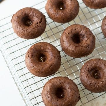 chocolate donuts on a rack