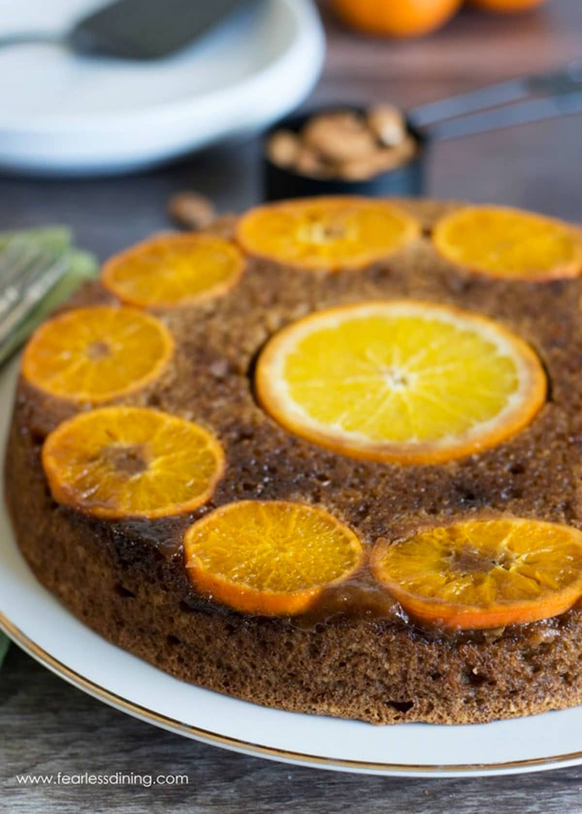 a gluten free orange cake on a cake plate