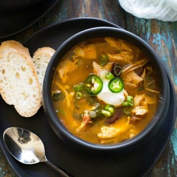 The top view of a bowl of Mexican chicken soup.