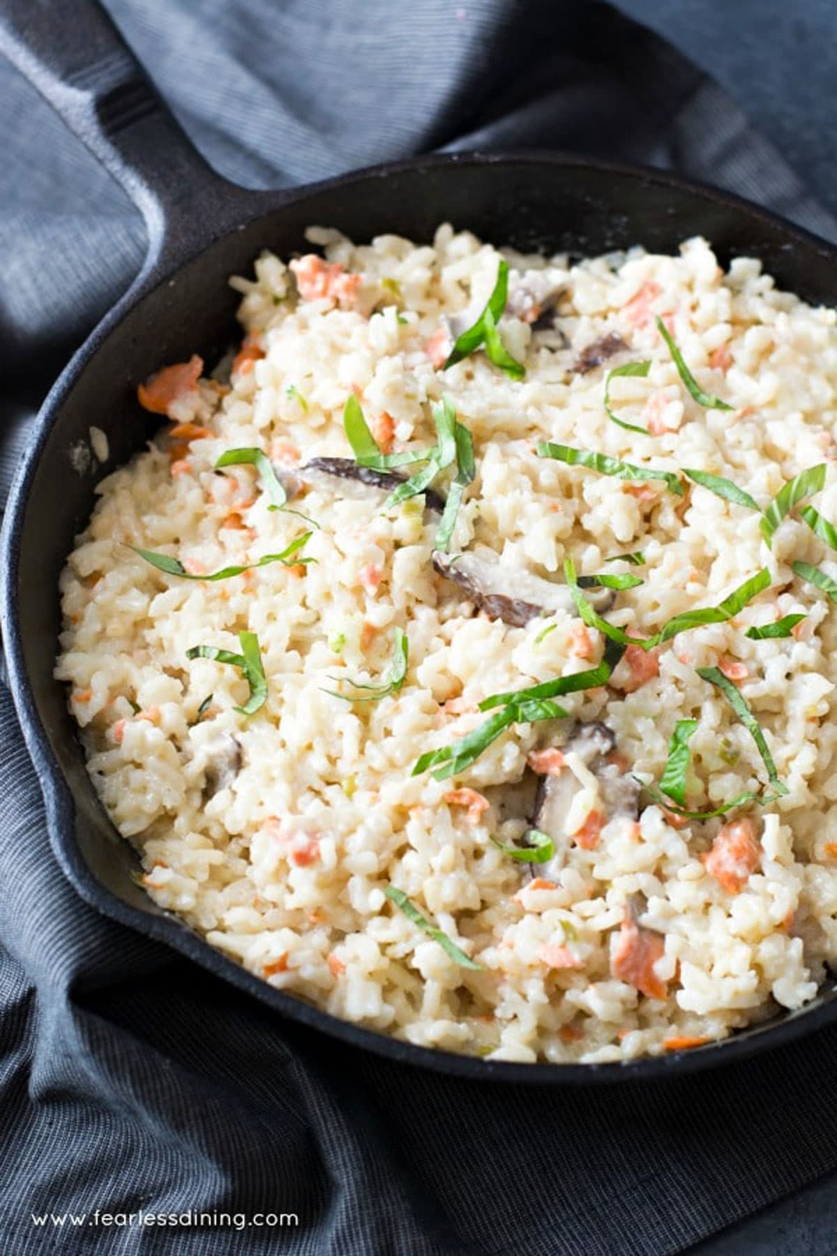 A skillet full of smoked salmon risotto.