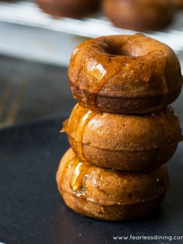 A stack of three mini almond flour donuts.