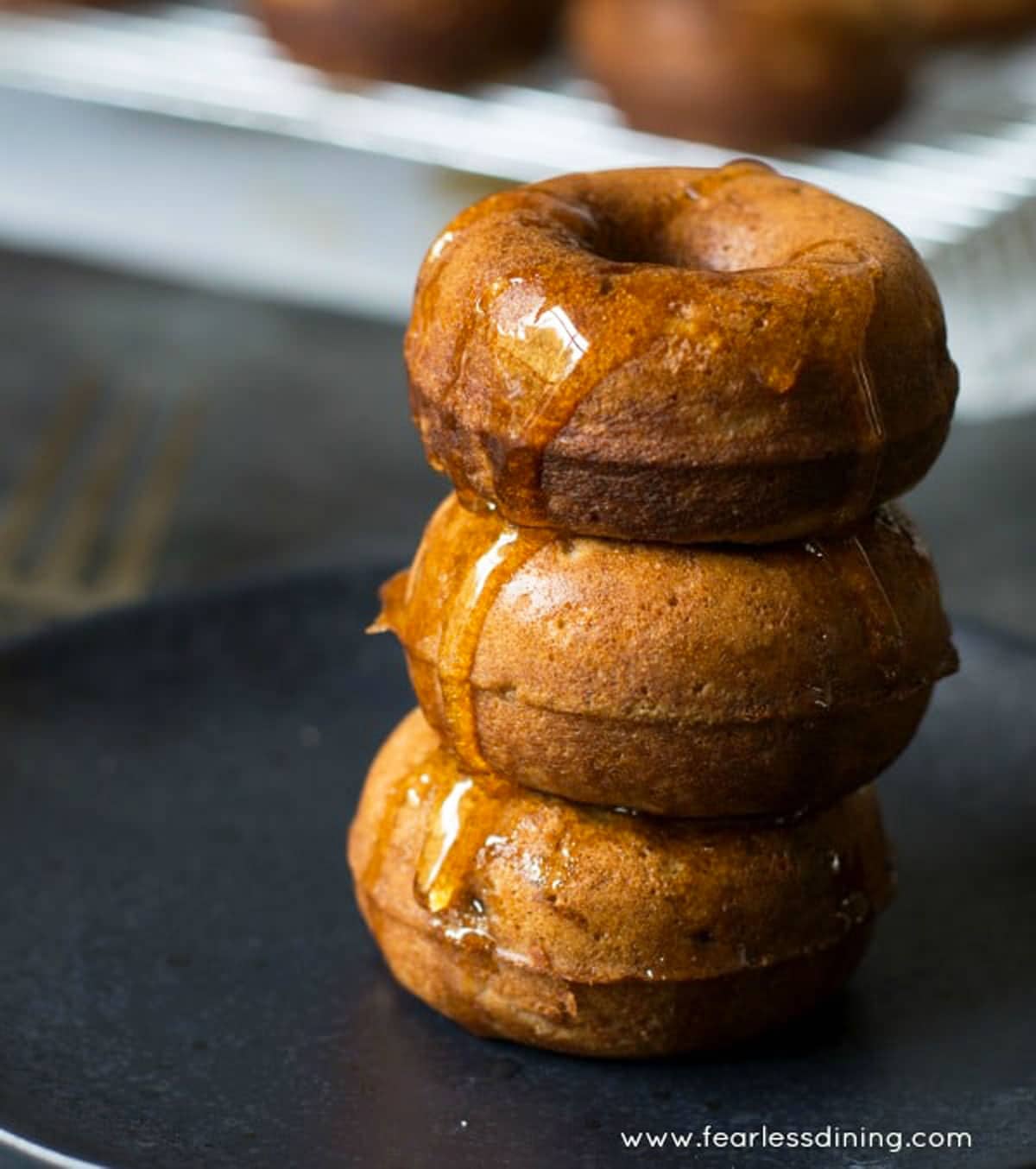 A stack of three mini almond flour donuts.