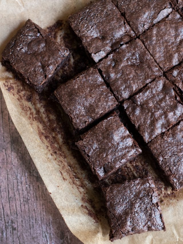 Cut gluten free brownies on a baking sheet.