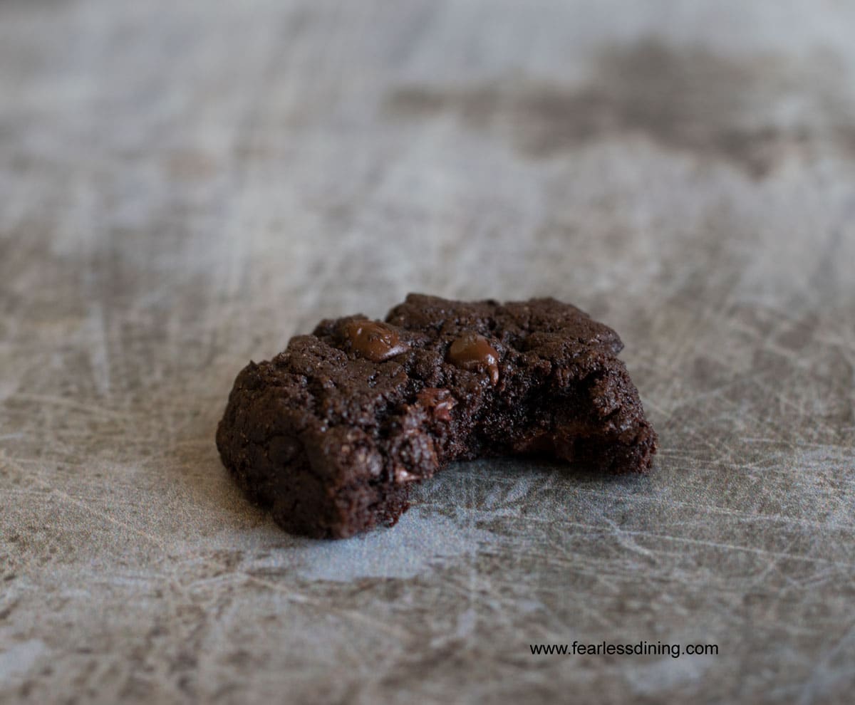 a chocolate espresso cookie with a bite taken out.