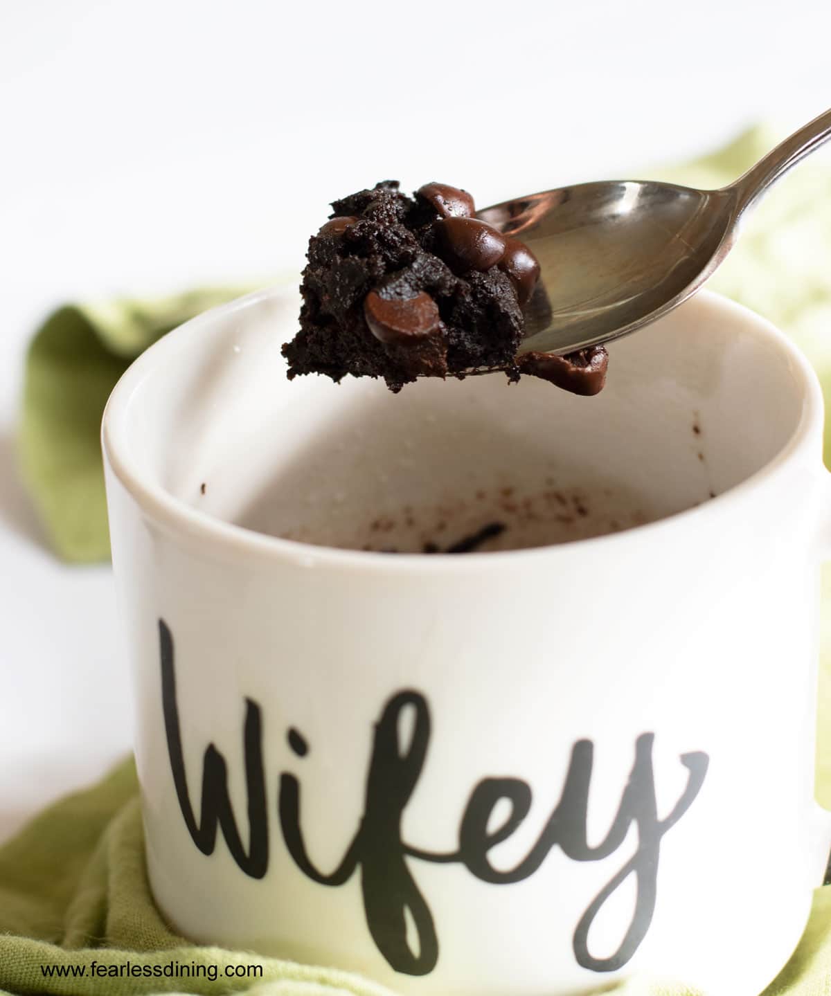 A spoonful of cooked gluten free mug brownie.